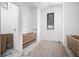 Bright bathroom featuring wood vanity cabinets, geometric tile, and a window for natural light at 114 Fillmore Dr, Sarasota, FL 34236