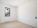 Bedroom view shows bright white walls, flooring, and new window that provides ample natural light at 114 Fillmore Dr, Sarasota, FL 34236