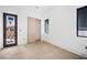 Bedroom featuring a wooden floor and modern black windows at 114 Fillmore Dr, Sarasota, FL 34236