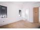 A Bedroom with a doorway and modern black windows at 114 Fillmore Dr, Sarasota, FL 34236