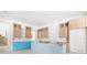 Spacious kitchen with unfinished wood cabinets and a large center island ready for final touches at 114 Fillmore Dr, Sarasota, FL 34236