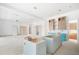 Open-concept kitchen featuring unfinished cabinets and a spacious layout ready for customization at 114 Fillmore Dr, Sarasota, FL 34236