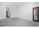 A large and open room featuring smooth concrete floor and white walls at 114 Fillmore Dr, Sarasota, FL 34236