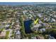 Aerial view showcases the home's scenic lakeside setting in a well-maintained neighborhood at 1310 91St Nw Ct, Bradenton, FL 34209