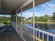 A screened-in balcony overlooks the lake at 1310 91St Nw Ct, Bradenton, FL 34209