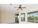 Bright bedroom with two large windows and a sliding glass door to a balcony at 1310 91St Nw Ct, Bradenton, FL 34209