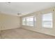 Spacious bedroom features a bay window and a ceiling fan at 1310 91St Nw Ct, Bradenton, FL 34209