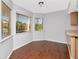 Bright breakfast nook featuring hardwood floors and large windows offering a cozy spot for casual dining at 1310 91St Nw Ct, Bradenton, FL 34209