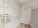 Walk-in closet with carpet and shelving, ready for storage and organization in a home at 1310 91St Nw Ct, Bradenton, FL 34209