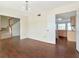 Open-concept dining room next to staircase and kitchen featuring hardwood floors and natural light at 1310 91St Nw Ct, Bradenton, FL 34209