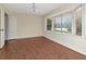 Elegant dining room featuring a large bay window, chair rail, hardwood floors and natural light at 1310 91St Nw Ct, Bradenton, FL 34209