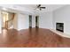 Open-concept living room with tile floors, a fireplace, and staircase, offering versatile living and entertaining space at 1310 91St Nw Ct, Bradenton, FL 34209