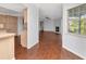 Spacious living space combining kitchen and living room with seamless transition and abundant natural light at 1310 91St Nw Ct, Bradenton, FL 34209