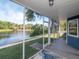A waterfront view from the screened porch with ceiling, and an outdoor rug at 1310 91St Nw Ct, Bradenton, FL 34209