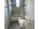 Bathroom featuring a tub with tile surround and modern fixtures at 14343 Myakka Ave, Port Charlotte, FL 33953