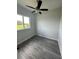 Bedroom with ceiling fan, and natural light from the window at 14343 Myakka Ave, Port Charlotte, FL 33953