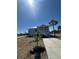 Charming two-story home with elevated porch, white railings, and new landscaping at 14343 Myakka Ave, Port Charlotte, FL 33953