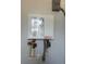 Wall mounted electric water heater installed in the utility area at 14343 Myakka Ave, Port Charlotte, FL 33953