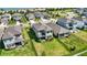 Backyard aerial view highlighting lush lawn, fenced yard, patio, and neighborhood street access at 16119 Paynes Mill Dr, Bradenton, FL 34211