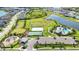 Beautiful aerial view of the community's amenities, including sports fields, pool, and green spaces at 16119 Paynes Mill Dr, Bradenton, FL 34211