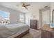 Bright bedroom featuring carpet, two large windows and ceiling fan at 16119 Paynes Mill Dr, Bradenton, FL 34211