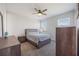 Serene bedroom with a ceiling fan, carpeted floor, and lots of natural light at 16119 Paynes Mill Dr, Bradenton, FL 34211