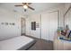 Bright bedroom featuring a ceiling fan, gray walls, a large closet, and a comfortable bed at 16119 Paynes Mill Dr, Bradenton, FL 34211
