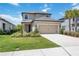 Charming two-story home with a well-manicured lawn and a two car garage, a welcoming Gathering home at 16119 Paynes Mill Dr, Bradenton, FL 34211