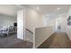 Upstairs landing featuring modern carpet and easy access to the bedrooms at 16119 Paynes Mill Dr, Bradenton, FL 34211