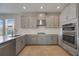 Well-equipped kitchen featuring stainless steel appliances, a gas range, and stylish countertops, perfect for cooking at 16119 Paynes Mill Dr, Bradenton, FL 34211