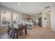 Bright open-concept shows kitchen, dining, and windows with views to exterior neighborhood at 16119 Paynes Mill Dr, Bradenton, FL 34211