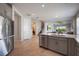 Contemporary kitchen with stainless steel appliances, a large island, and an open layout, perfect for entertaining at 16119 Paynes Mill Dr, Bradenton, FL 34211