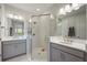 Beautiful bathroom with double sinks, granite counters, and a glass shower enclosure at 16119 Paynes Mill Dr, Bradenton, FL 34211