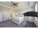 Well-lit main bedroom with a ceiling fan, neutral decor and cozy carpet at 16119 Paynes Mill Dr, Bradenton, FL 34211