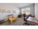 Playroom featuring a play table, shelves of toys and a desk with natural light from the window at 16119 Paynes Mill Dr, Bradenton, FL 34211
