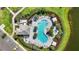 Overhead view of the resort-style community pool with lush landscaping and lounge areas at 16119 Paynes Mill Dr, Bradenton, FL 34211
