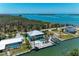 This beautiful coastal home features a lush lawn, in-ground pool, access to a canal, and is near the coast at 1918 Massachusetts Ave, Englewood, FL 34224