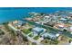 Breathtaking aerial view of a beautiful waterfront property with lush landscaping and private boat dock at 1918 Massachusetts Ave, Englewood, FL 34224