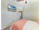 Bedroom features ceiling fan and a TV, creating a relaxing retreat at 1918 Massachusetts Ave, Englewood, FL 34224