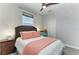 Calm bedroom with a woven headboard and a cozy pink blanket at 1918 Massachusetts Ave, Englewood, FL 34224