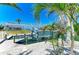 Waterfront view of a boat dock with boat lift, providing convenient access to the water for boating enthusiasts at 1918 Massachusetts Ave, Englewood, FL 34224