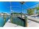 Waterfront boat lift providing easy access to the water, offering convenience for boating and water activities at 1918 Massachusetts Ave, Englewood, FL 34224
