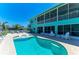 Stunning view of the pool and covered patio with scenic water views creating a backyard retreat at 1918 Massachusetts Ave, Englewood, FL 34224