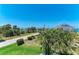 Picturesque street view showing a lovely home surrounded by lush tropical landscaping at 1918 Massachusetts Ave, Englewood, FL 34224