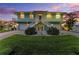 An exterior elevation shows the home's well-manicured lawn, dual-car garage, and coastal charm at 1918 Massachusetts Ave, Englewood, FL 34224