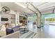 Versatile garage space with a comfortable seating area, ceiling fan, and easy access to the outdoors, great for entertaining at 1918 Massachusetts Ave, Englewood, FL 34224