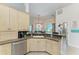 Kitchen area featuring stainless steel appliances, ample counter space, and access to the dining area at 1918 Massachusetts Ave, Englewood, FL 34224