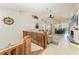 Open-concept living space with staircase, fireplace, and dining area at 1918 Massachusetts Ave, Englewood, FL 34224