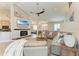 Cozy living room with modern fireplace and views of the canal at 1918 Massachusetts Ave, Englewood, FL 34224
