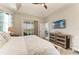 This main bedroom features a private balcony, TV, and a spacious layout at 1918 Massachusetts Ave, Englewood, FL 34224